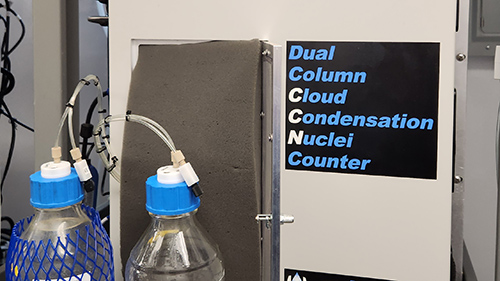 Two water bottles, one for distilled water and the other for waste water, are connected to a dual column cloud condensation nuclei counter installed within an ARM Aerosol Observing System. ARM photo.